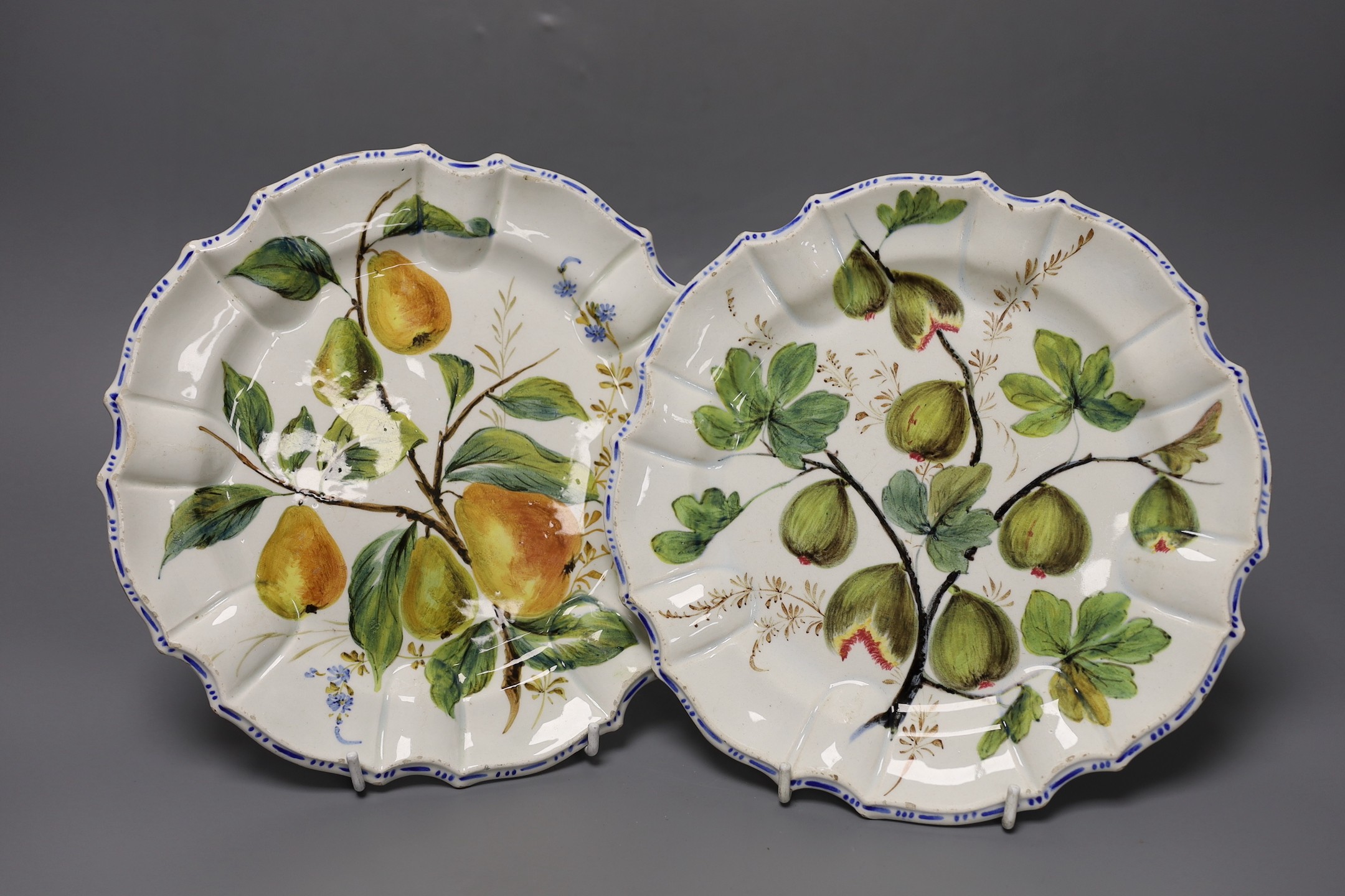 A pair of Meissen onion pattern candlesticks, 14 cm high, a Berlin figural salt, two Nove maiolica plates and a Richard Gingrich cache pot